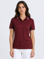 front view of primoknit drift polo tshirt unisex for women Maroon