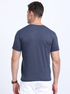 back view of man wearing t-shirt whose colour is Navy Melange