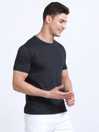 side view of man wearing t-shirt whose colour is Charcoal