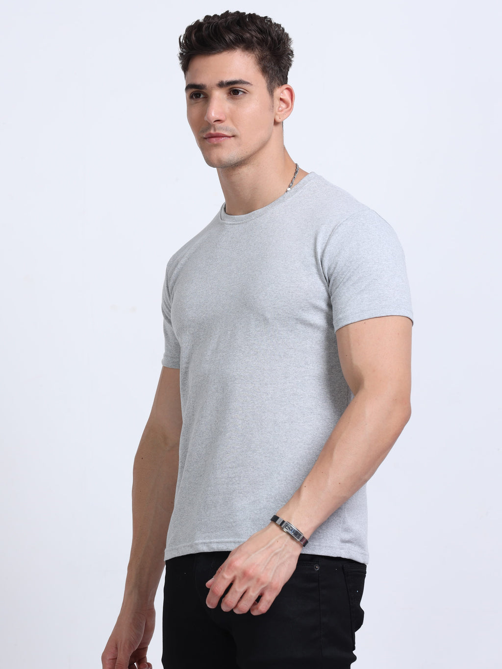 side view of man wearing t-shirt whose colour is Grey Melange .