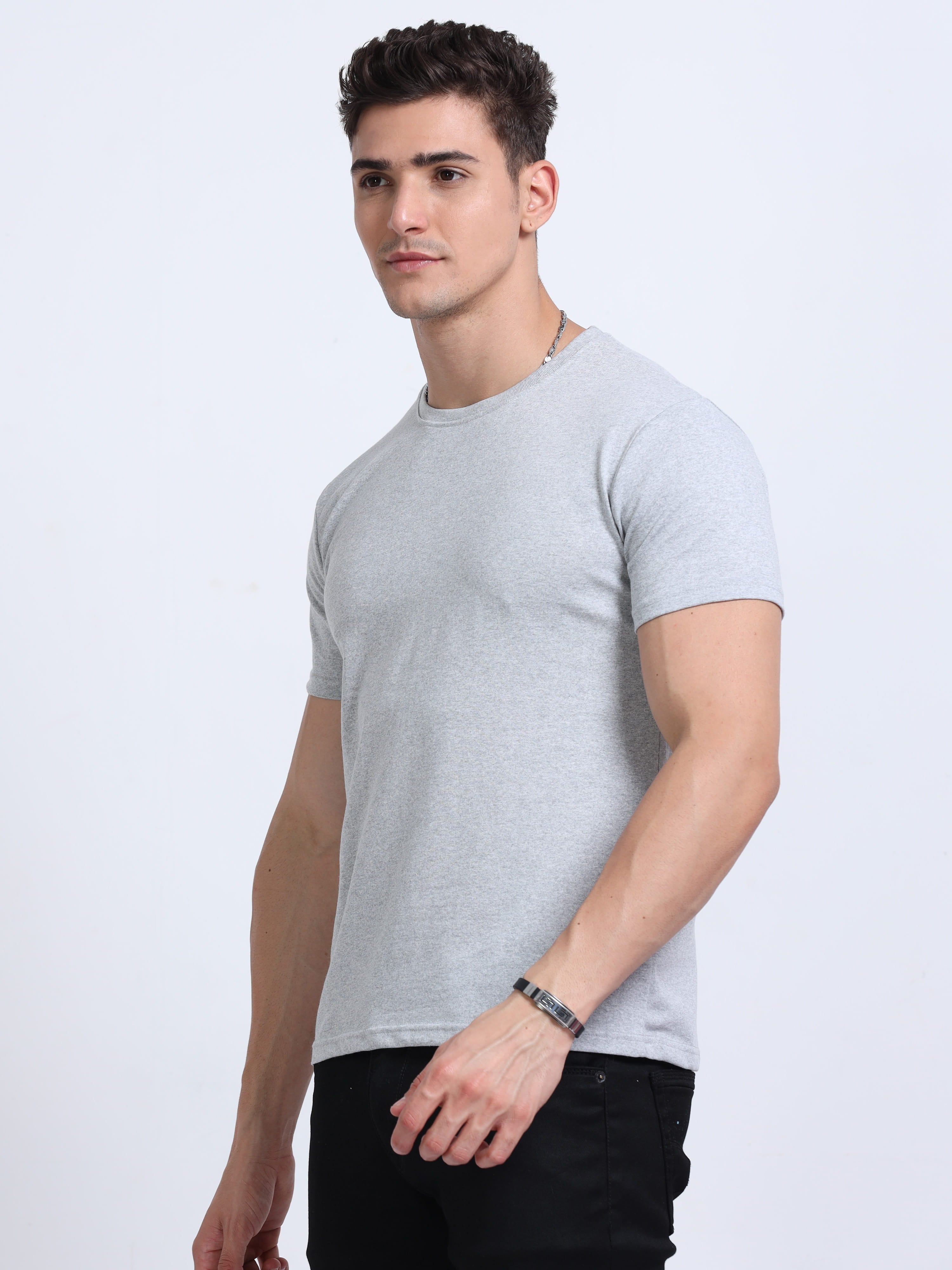 side view of man wearing t-shirt whose colour is Grey Melange .