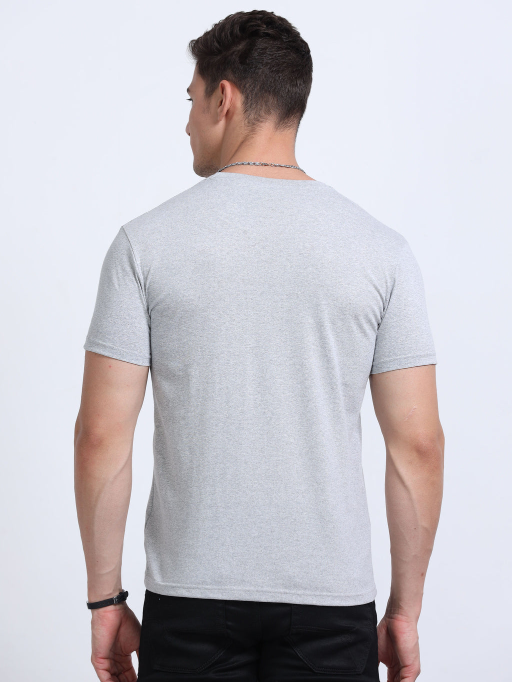back view of man wearing t-shirt whose colour is Grey Melange .