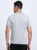 back view of man wearing t-shirt whose colour is Grey Melange .