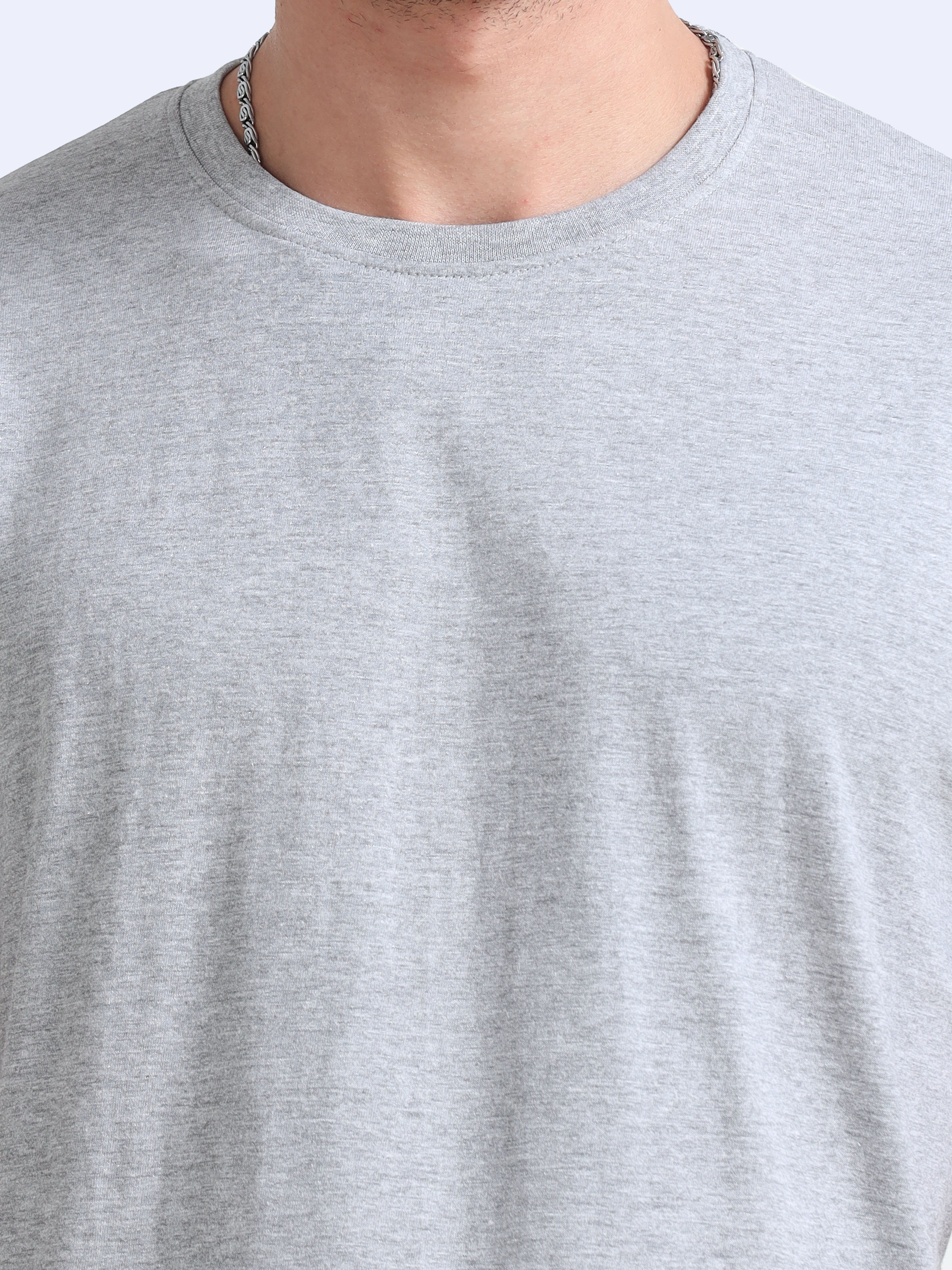 man wearing a t-shirt with close view in grey melange 