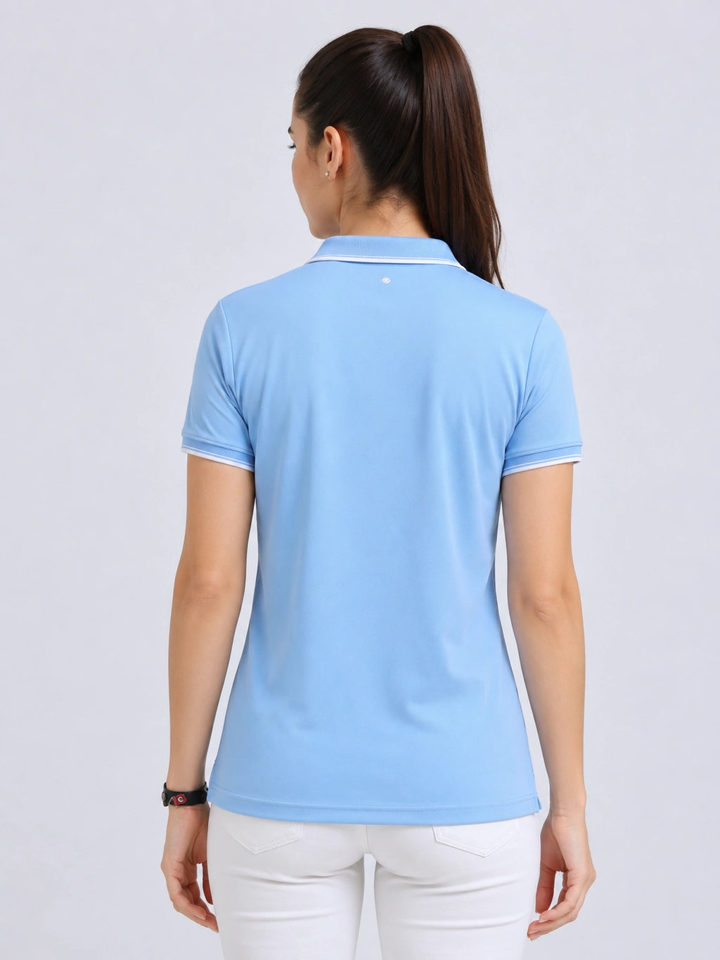 back view of primoknit drift polo tshirt unisex for women Sky Blue