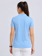 back view of primoknit drift polo tshirt unisex for women Sky Blue