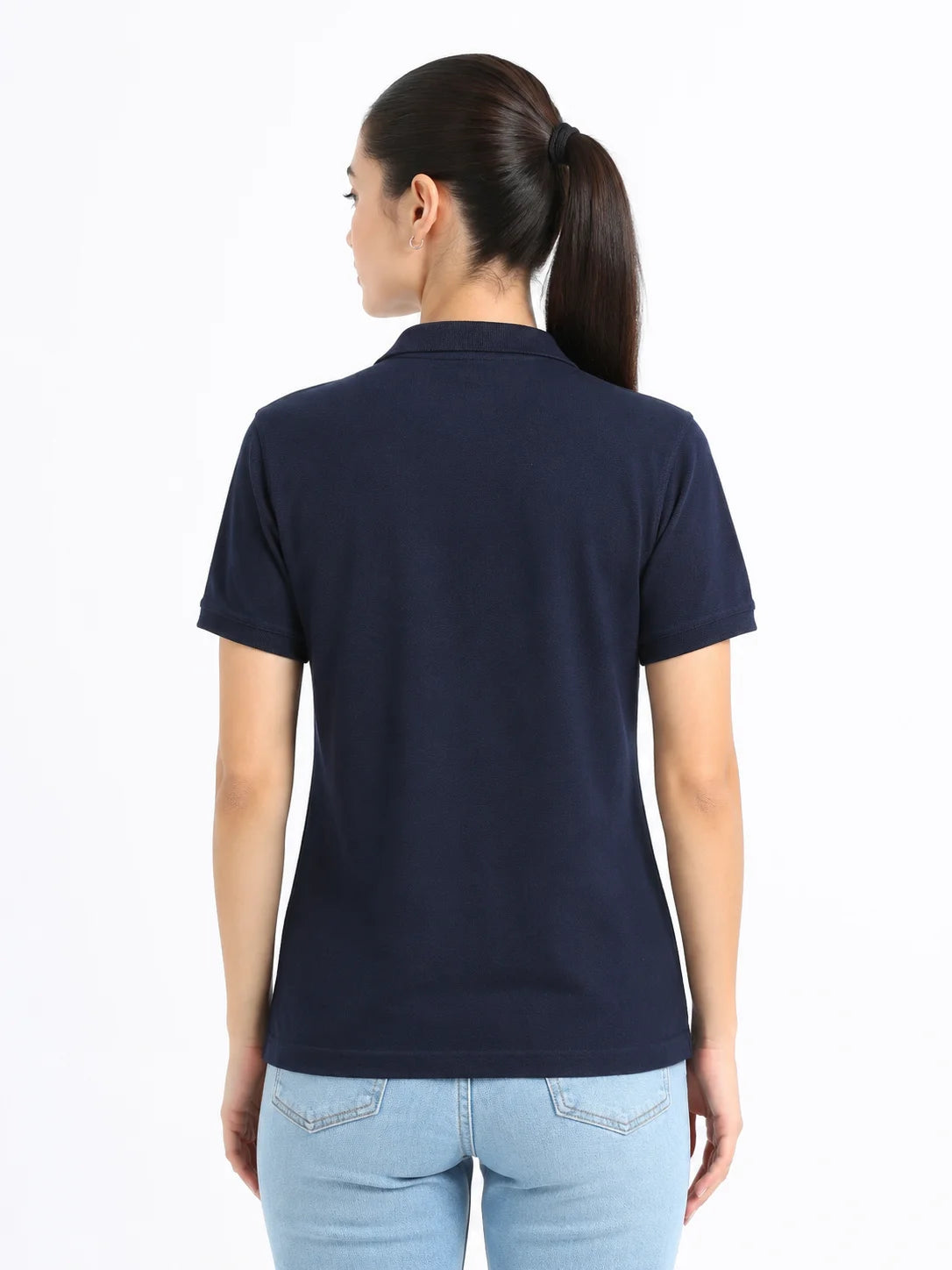 back view of women Wearing  organic cotton polo t-shirt navy blue