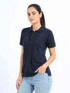 front side view of women Wearing  organic cotton polo t-shirt navy blue