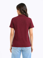 back view of women Wearing  organic cotton polo t-shirt maroon