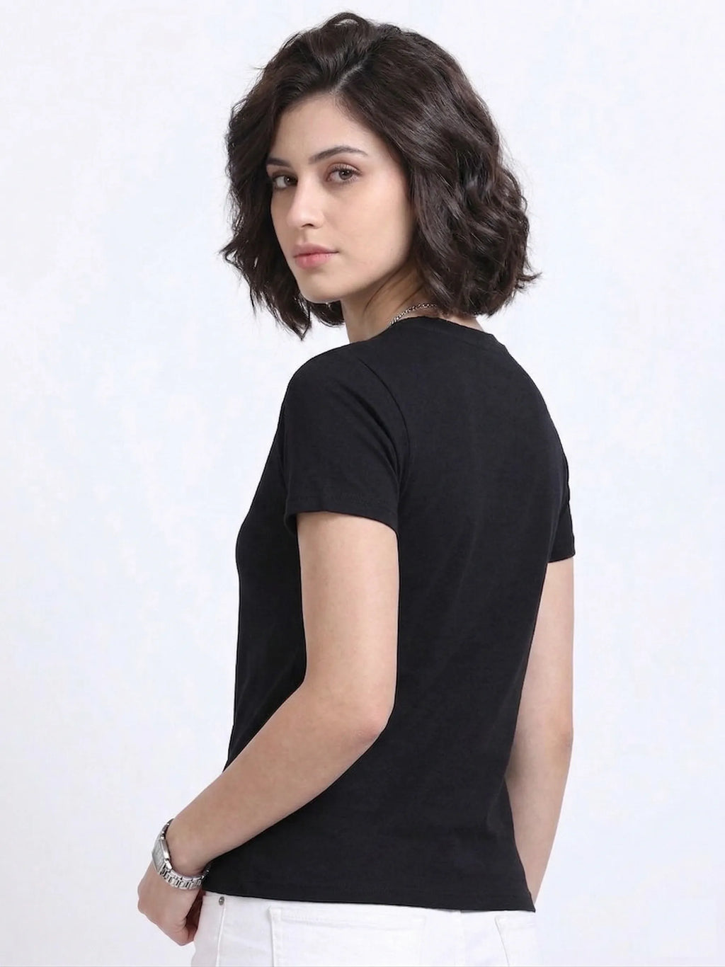 side view of woman wearing t-shirt whose colour is Black