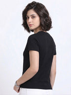 side view of woman wearing t-shirt whose colour is Black