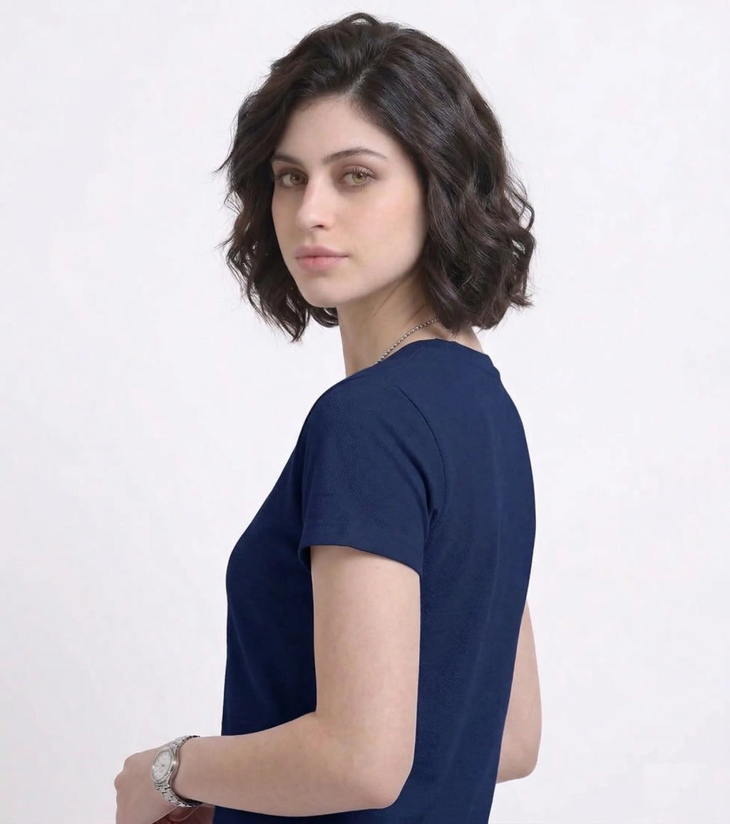 side view of woman wearing t-shirt whose colour is Navy Blue