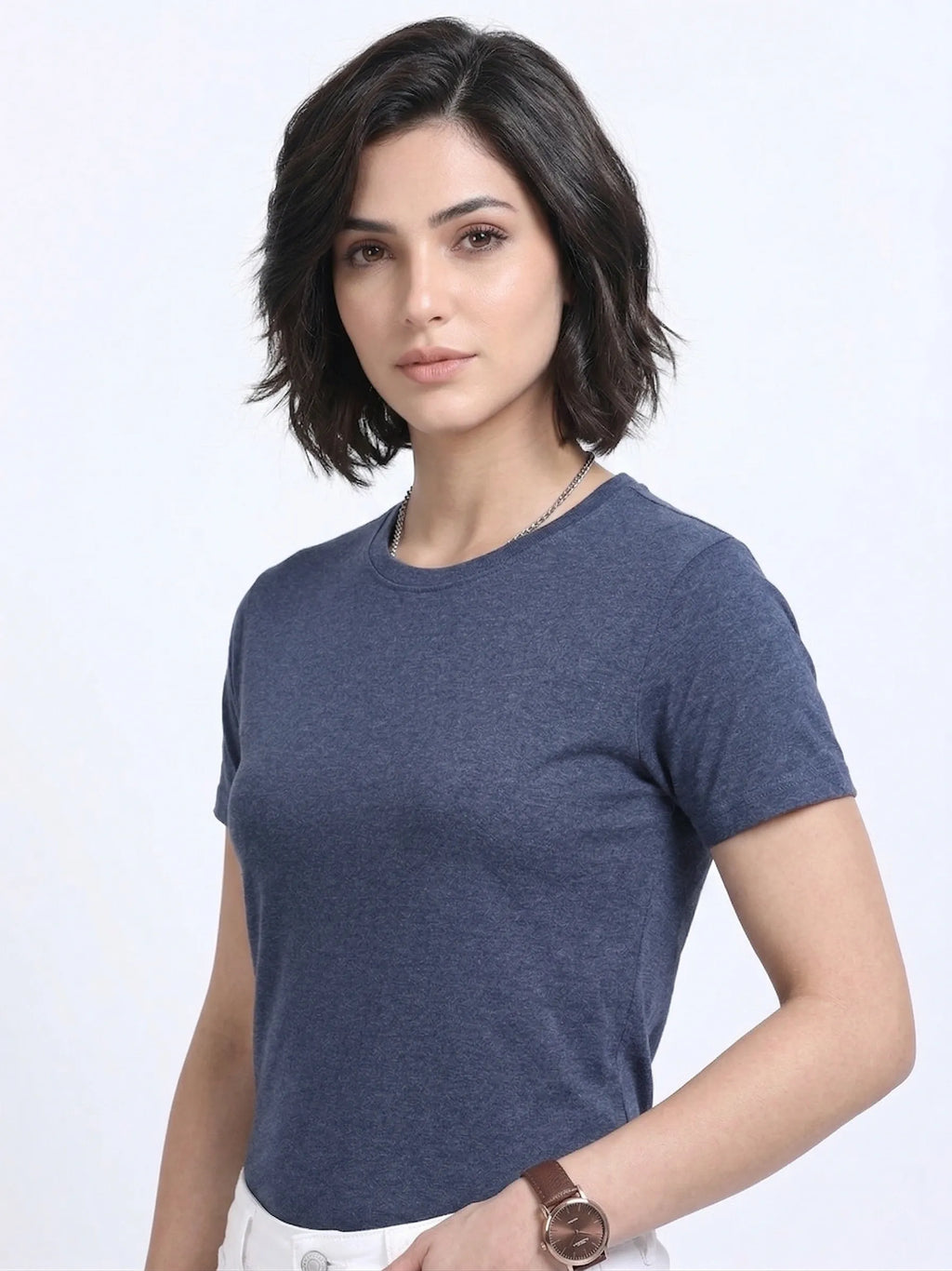 side view of woman wearing t-shirt whose colour is Navy Melange