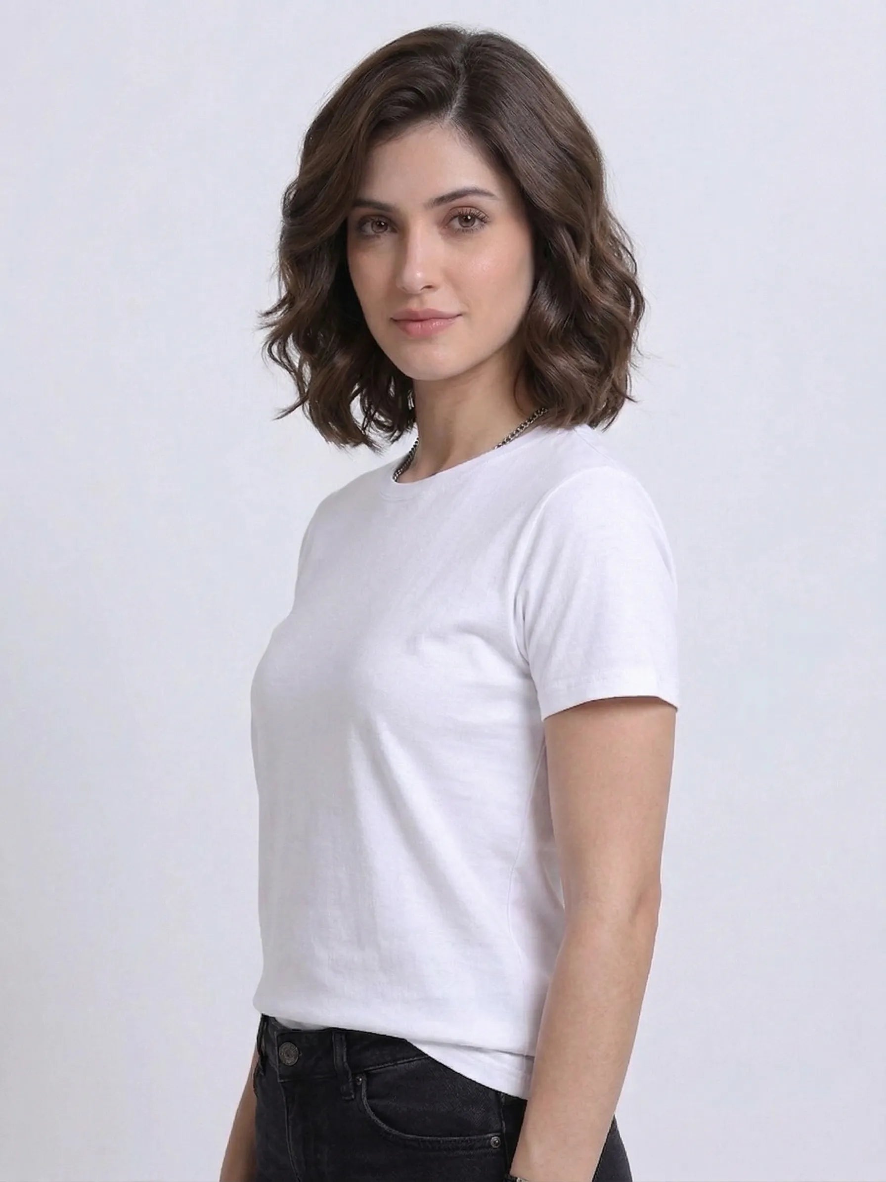 side view of woman wearing t-shirt whose colour is White