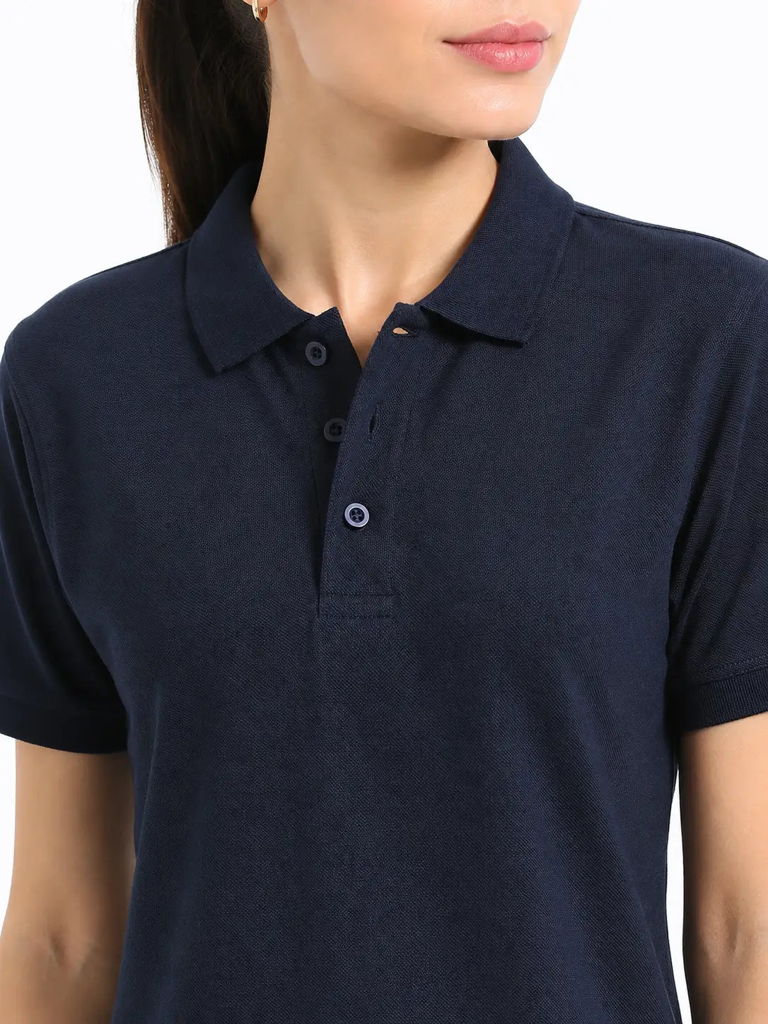 close view of women Wearing  organic cotton polo t-shirt navy blue