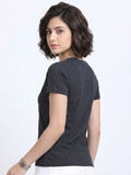 side view of woman wearing t-shirt whose colour is Charcoal 